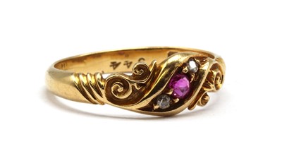Lot 20 - An 18ct gold ruby and diamond three stone ring