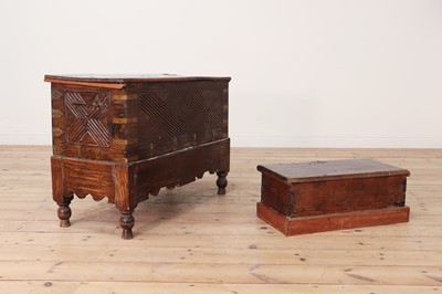 Lot 126 - Two Omani hardwood chests and a brass pestle and mortar