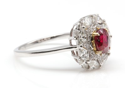 Lot 498 - An unheated Burmese ruby and diamond oval cluster ring