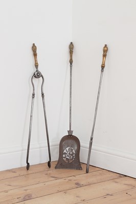 Lot 389 - A set of three George III steel and ormolu fire irons