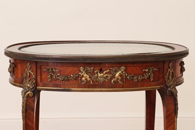 Lot 376 - A transitional-style kingwood and ormolu bijouterie table in the manner of François Linke
