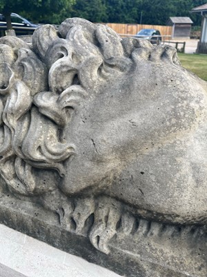 Lot 404 - A pair of monumental marble lions on plinths