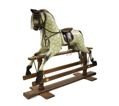 Lot 203 - A modern carved wooden rocking horse