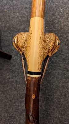 Lot 183 - A group three carved walking sticks by Sam Wright of Norfolk