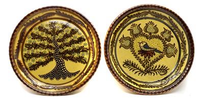 Lot 72 - A pair of slipware chargers
