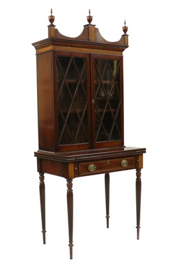 Lot 321 - A mahogany display cabinet on stand