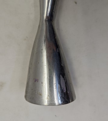 Lot 50 - A pair of polished steel candlesticks