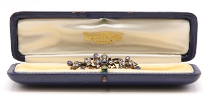 Lot 102 - A late Victorian sapphire and diamond spray bar brooch, c.1890