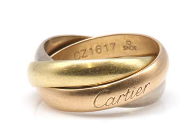Lot 344 - An 18ct three colour gold 'Trinity' ring, by Cartier