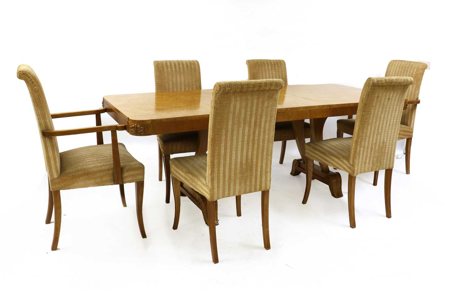 Lot 105 - An Art Deco burr maple dining table and six chairs