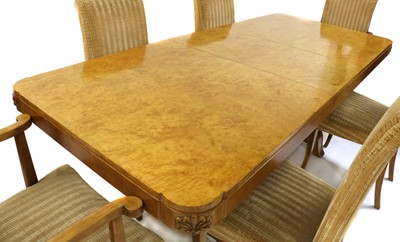 Lot 105 - An Art Deco burr maple dining table and six chairs