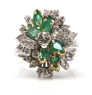 Lot 464 - A diamond and emerald spray style cocktail ring