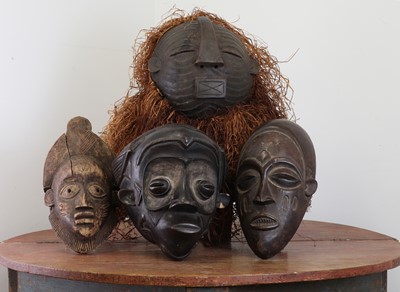 Lot 304 - A collection of carved softwood African masks