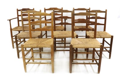 Lot 48 - A matched set of eight Arts and Crafts 'Gimson' oak and ash ladder back chairs