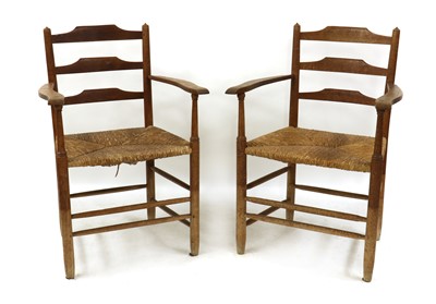 Lot 48 - A matched set of eight Arts and Crafts 'Gimson' oak and ash ladder back chairs