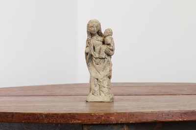 Lot 246 - A limestone carving of the Madonna and Child
