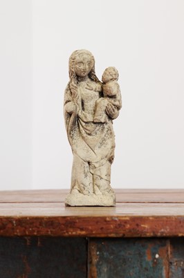 Lot 246 - A limestone carving of the Madonna and Child