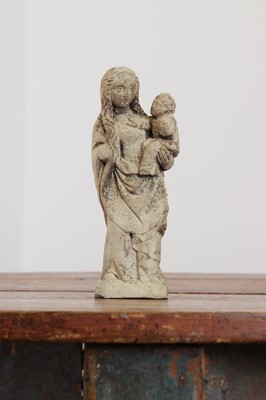 Lot 246 - A limestone carving of the Madonna and Child
