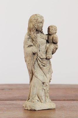 Lot 246 - A limestone carving of the Madonna and Child