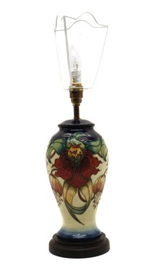 Lot 99 - A Moorcroft pottery 'Anna Lily' pattern table lamp