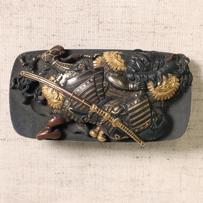 Lot 214 - A Japanese mixed-metal, gold and silver inlaid buckle