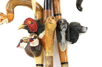 Lot 184 - A group of three carved walking sticks by Sam Wright of Norfolk