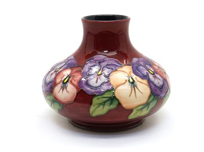 Lot 58 - A Moorcroft pottery ‘Pansy’ pattern vase