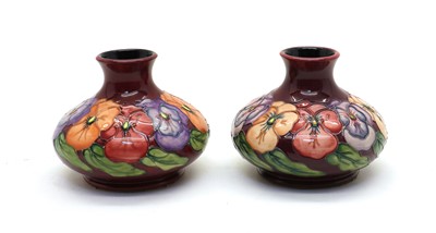Lot 59 - A pair of Moorcroft pottery ‘Pansy’ pattern vases