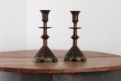 Lot 281 - A pair of oak and bell metal candlesticks