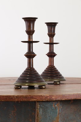 Lot 281 - A pair of oak and bell metal candlesticks