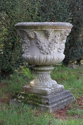 Lot 399 - A pair of weathered composite stone campana urns
