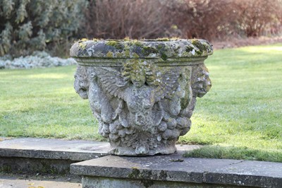 Lot 400 - A pair of weathered stone urns