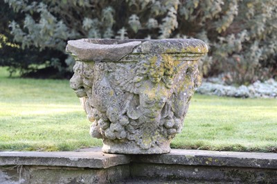 Lot 400 - A pair of weathered stone urns