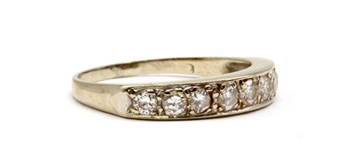 Lot 123 - An 18ct white gold diamond half eternity ring