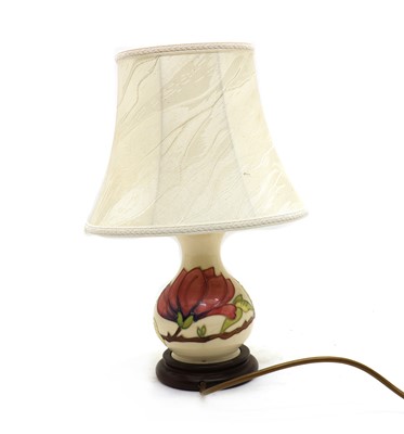 Lot 49 - A small Moorcroft pottery 'Anemone' pattern table lamp