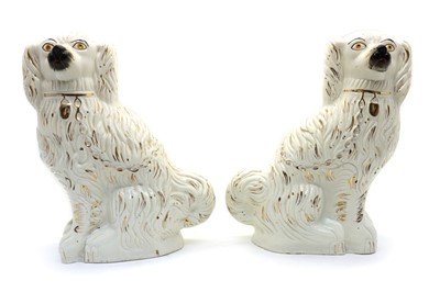 Lot 101 - A pair of large Staffordshire flatback spaniel dogs