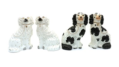 Lot 95 - A pair of Staffordshire pottery flatback spaniels