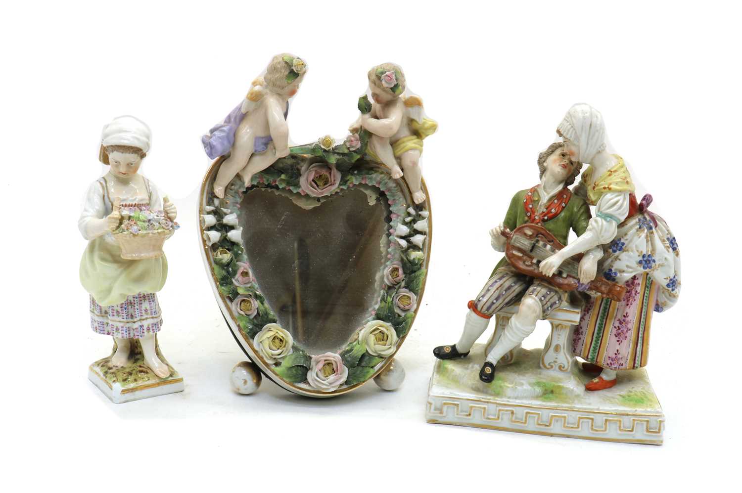 Lot 42 - A Dresden porcelain figure group of a hurdy-gurdy player and lady