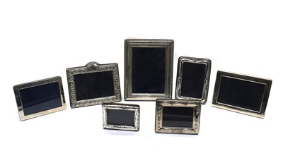 Lot 25 - A collection of seven silver mounted frames