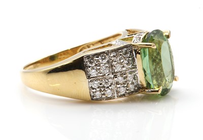 Lot 329 - An 18ct gold green tourmaline and diamond ring