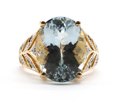 Lot An 18ct gold aquamarine and diamond ring