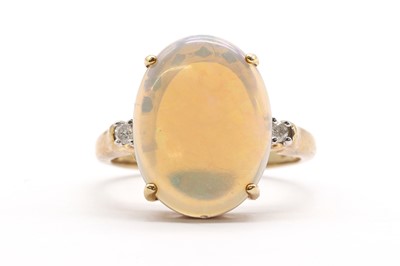 Lot 235 - A 9ct gold three stone opal and diamond ring