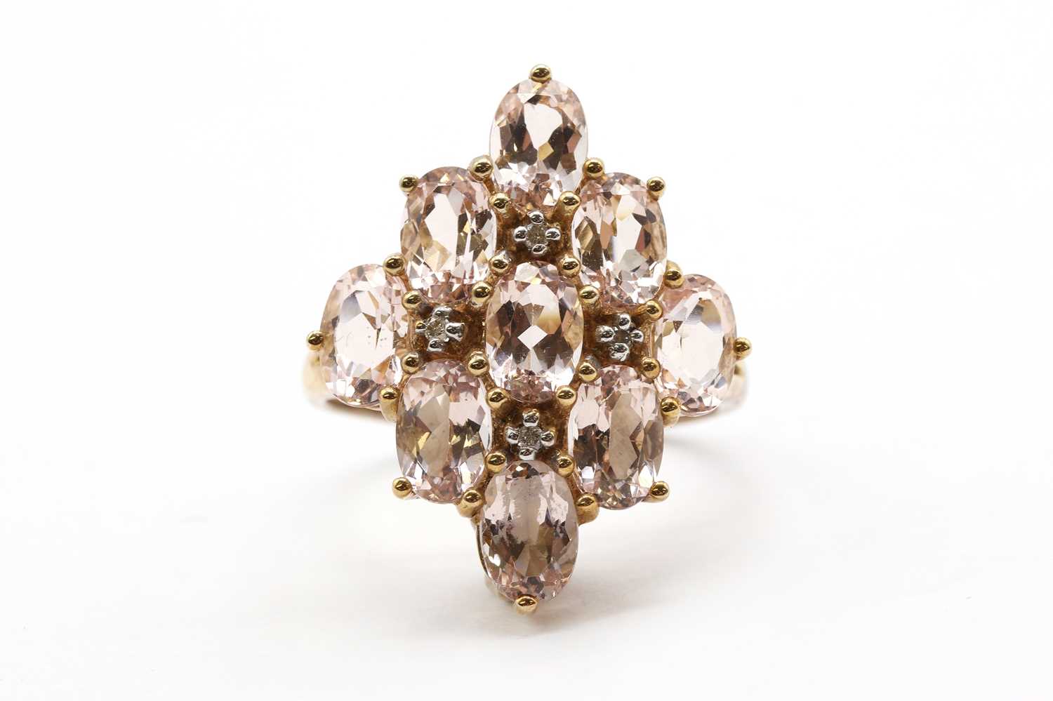 Lot 149 - A 9ct gold morganite and diamond cluster ring
