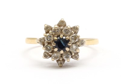 Lot 193 - An 18ct gold sapphire and diamond cluster ring