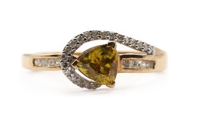 Lot 215 - A 9ct gold sphene and diamond ring