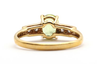 Lot 172 - An 18ct gold sphene and diamond ring