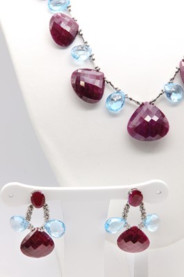 Lot 447 - A continental ruby and blue topaz necklace and earring suite