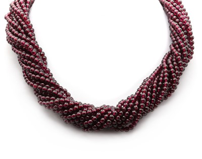 Lot 137 - A thirteen row garnet bead torsade necklace