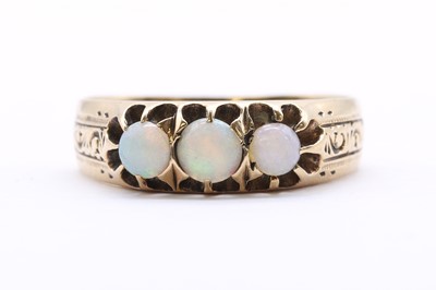 Lot 47 - A Continental gold three stone opal ring