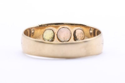 Lot 47 - A Continental gold three stone opal ring